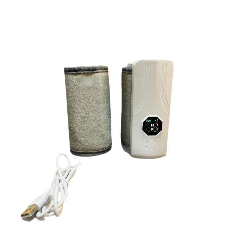 Grey and white electric milk warmer for car use with 12V charger plug.