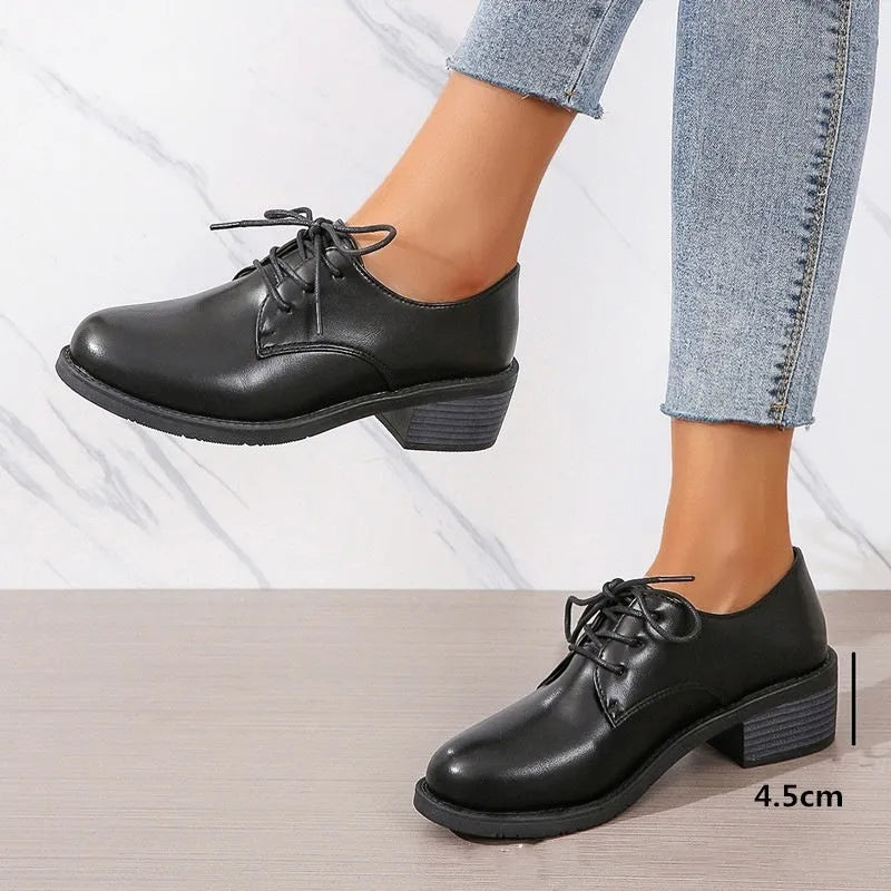 Black women's professional work shoes with chunky heel and low top design