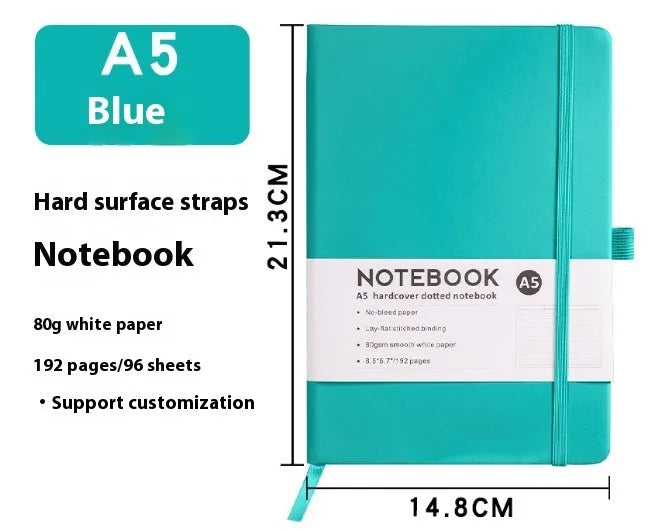 A5 size notebook with soft skin-feel PU leather cover and strap closure, open to show horizontal lined pages.