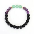Yoga lotus pendant necklace and bracelet set with stone beads on a white background