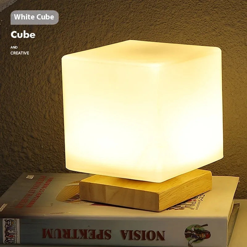 Nordic USB table lamp with geometric white light and solid wood decoration on bedside table
