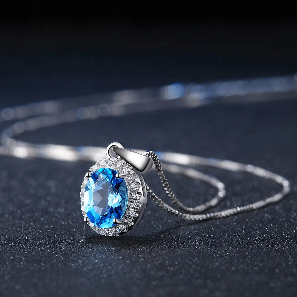 925 sterling silver geometric jewellery set with blue topaz gems including earrings, ring, necklace and pendant