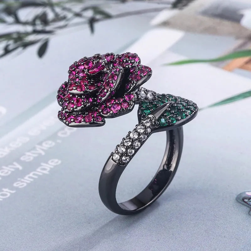 Geometric black gold ring with simulated red corundum stone and gold plating