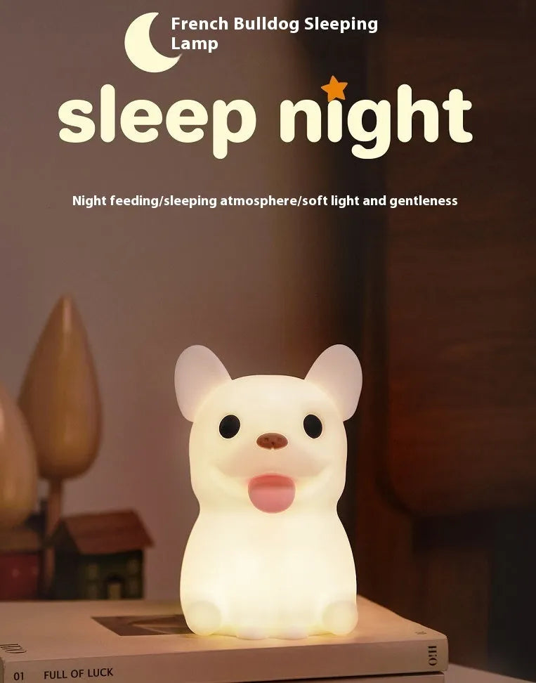 Silicone animal cartoon USB night light with Zodiac design on a bedside table.