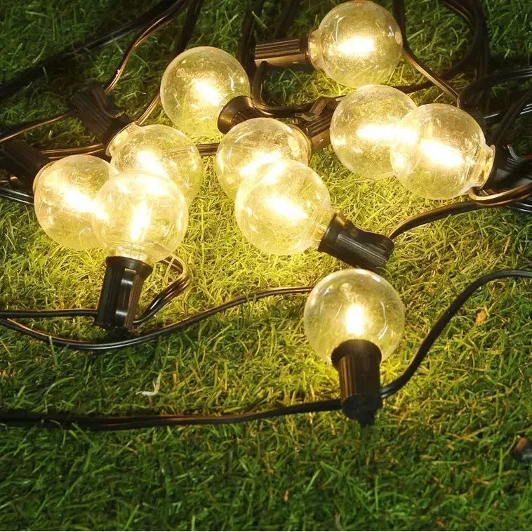 Outdoor waterproof LED lighting chain with warm light, plastic shell, IP44 rating, available in 7.5m, 16.5m, and 26.5m lengths.