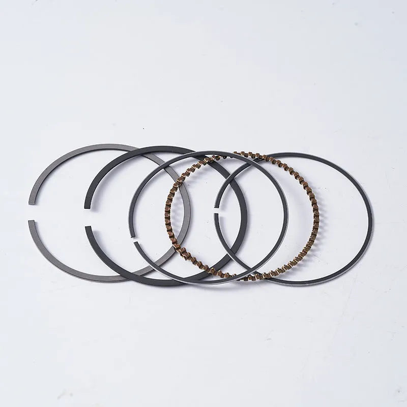Motorcycle engine piston kit showing aluminium alloy construction with 57.4mm diameter measurement