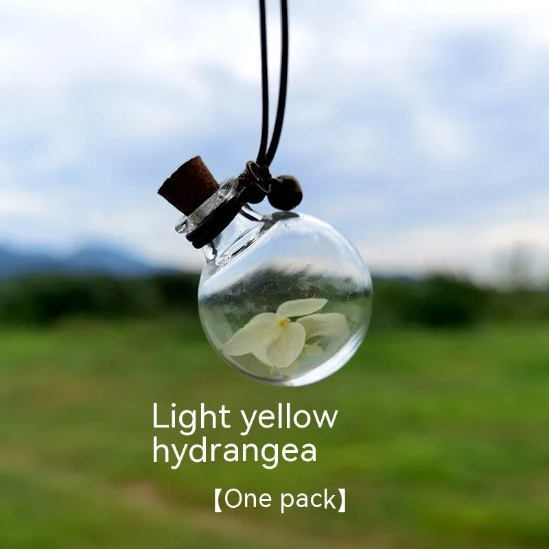 Glass car perfume pendant with preserved flowers for interior decoration and air freshening