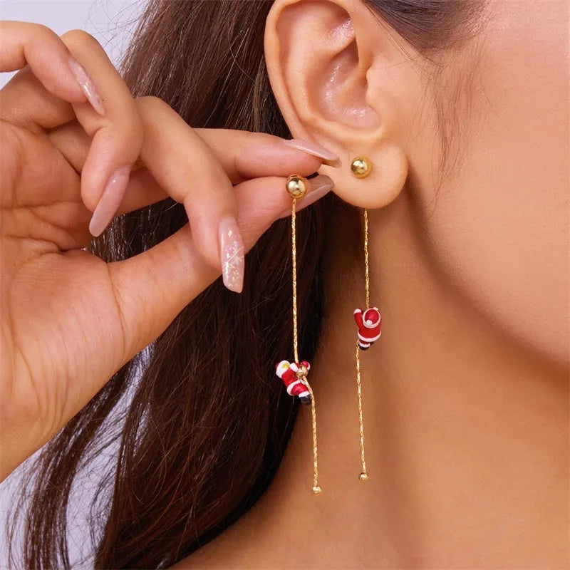 Asymmetric crawling Santa Christmas earrings for women in zinc alloy with inlaid diamond detail
