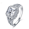 Women's platinum colour geometric zircon ring with hollow quadrilateral design on a copper band.