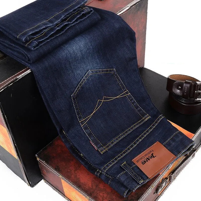 Men's loose straight casual work stretch jeans in blue elastic option with mid-waist and straight leg