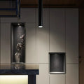 Black round surface mounted LED ceiling downlight spotlight with a 6cm diameter.