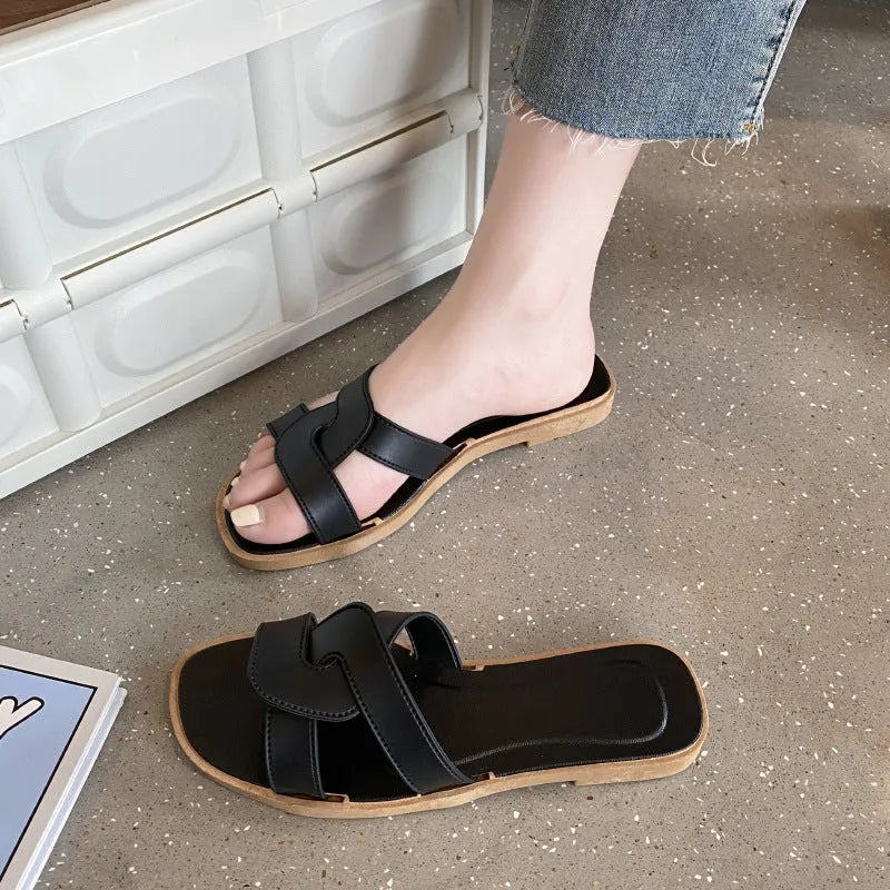 Women's cross strap PVC sandals in light blue, showing toe ring and non-slip sole.