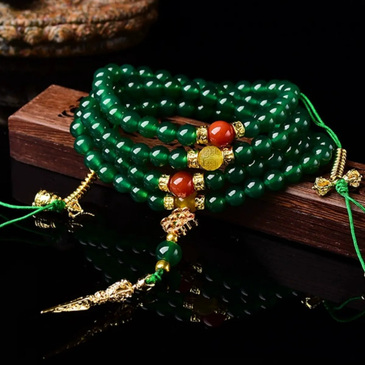 Natural green agate multi-circle bracelet for men and women on a wrist, showing different bead size options.