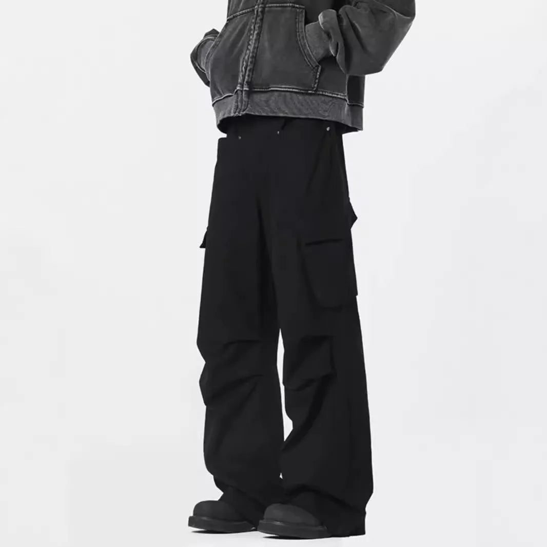 Men's beige straight-leg casual trousers with a high waist and button-fly front on a neutral background.