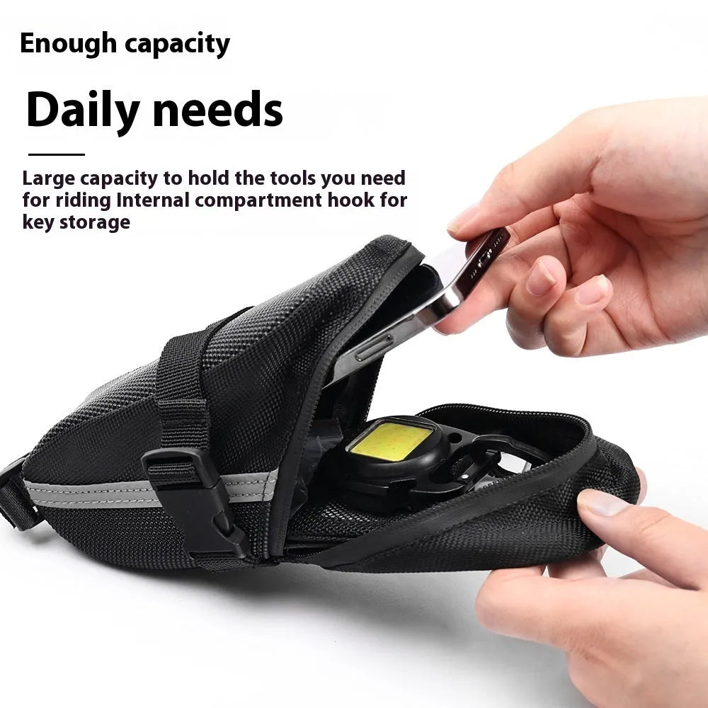 Black cycling tail bag with quick-release mounting for bicycle saddle