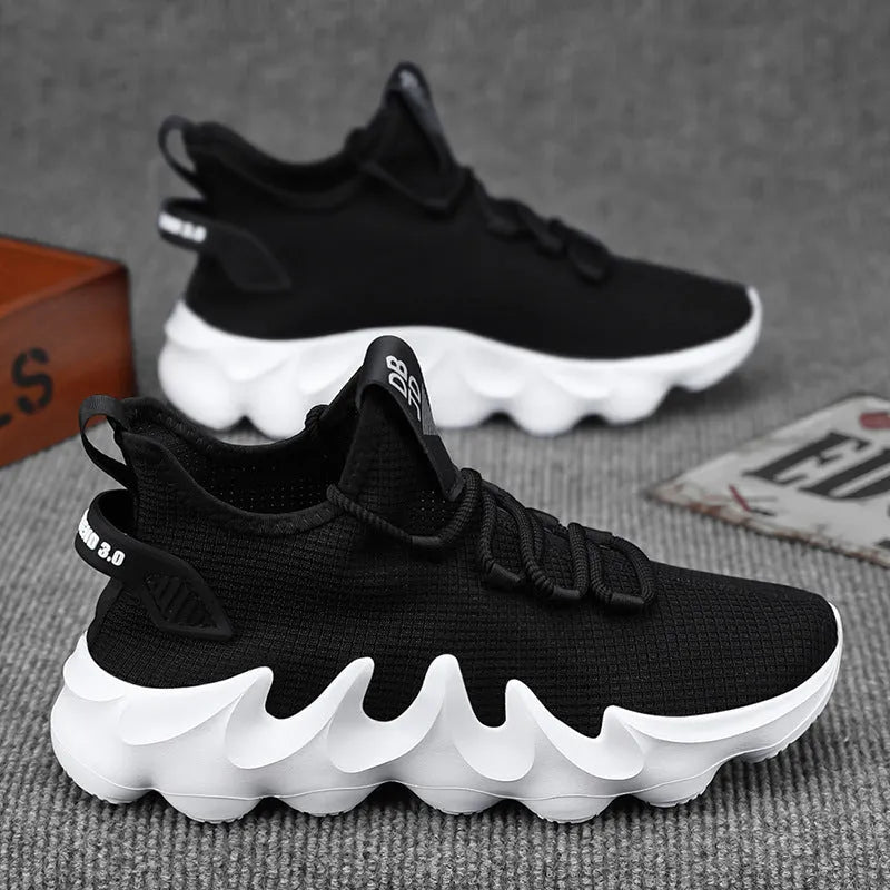 Men's low-top sock-like sports shoes in grey with a round toe, flat heel, and lace-up front.
