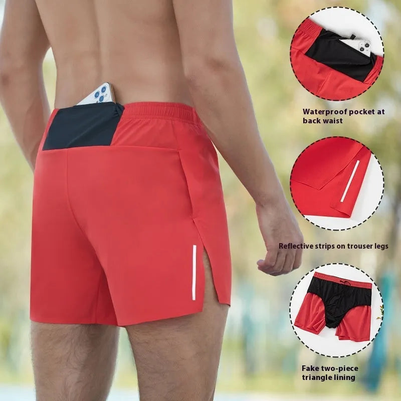 Men's loose-fit high-waist off-road running shorts in quick-dry fabric on a grey background.