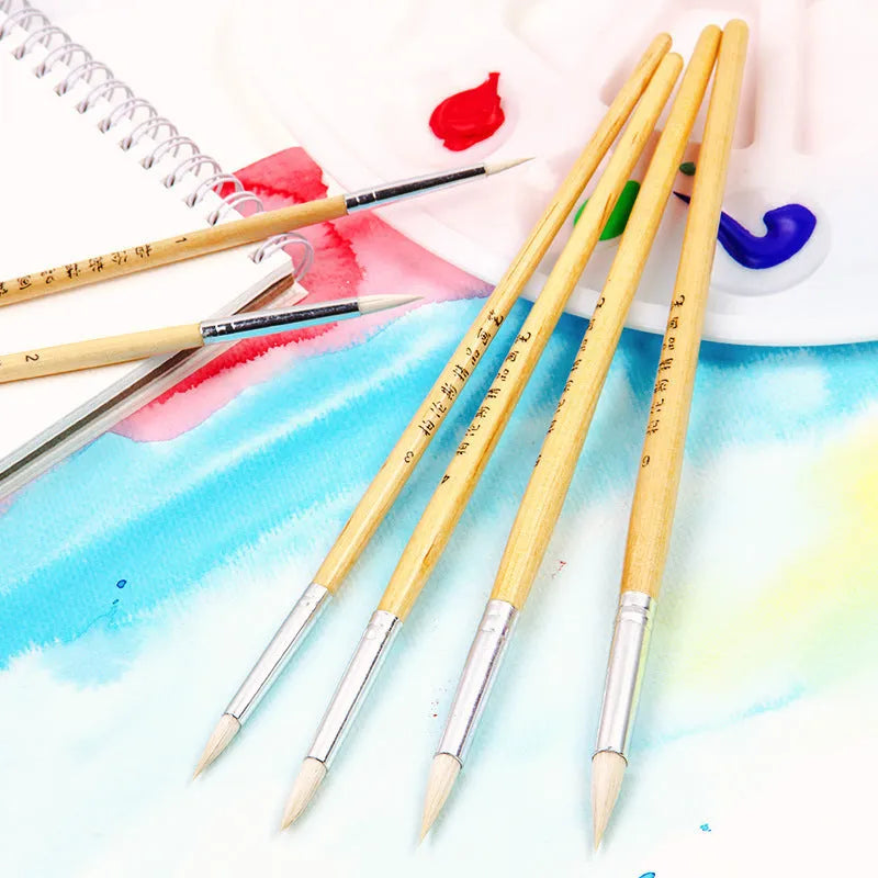 Set of six wooden-handled artist brushes with pointed synthetic wool bristles on a white background.
