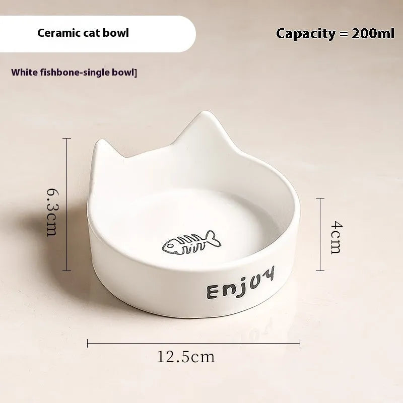 Porcelain cat bowl with cat ear and paw design on a wooden feeding frame, in pink colour.