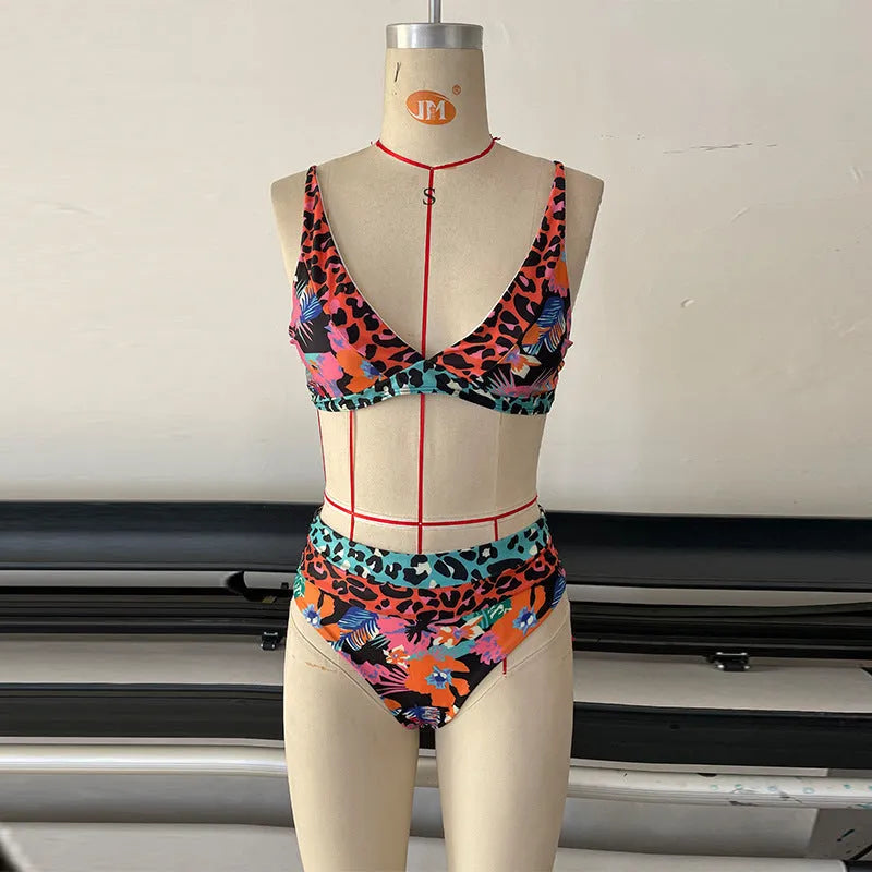 Women's floral print high-waisted bikini swimsuit set on a mannequin.