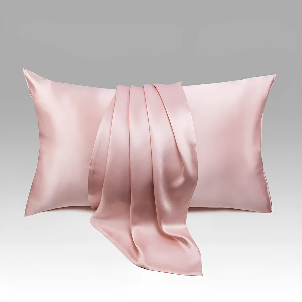 Dark grey silk pillowcase with envelope closure shown folded to display fabric texture