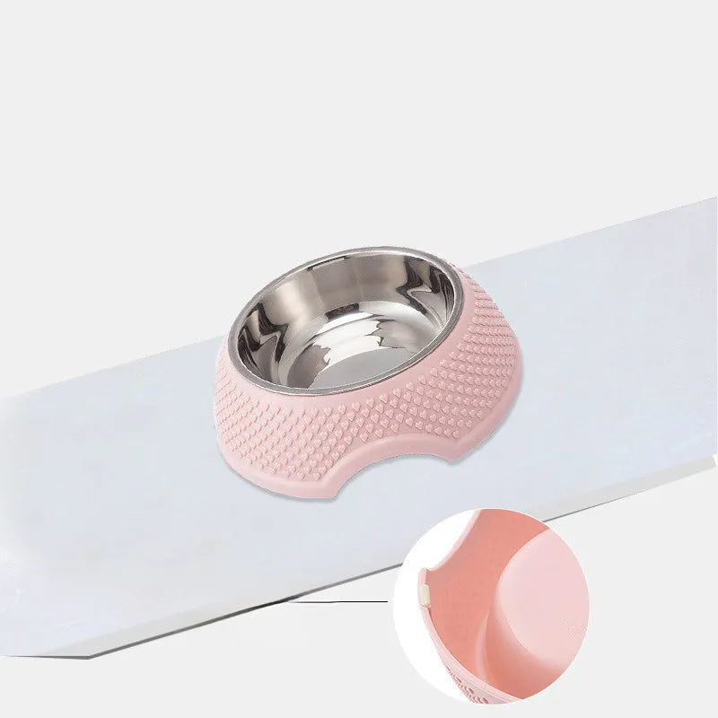 Blue stainless steel pet bowl with non-slip base on a floor.