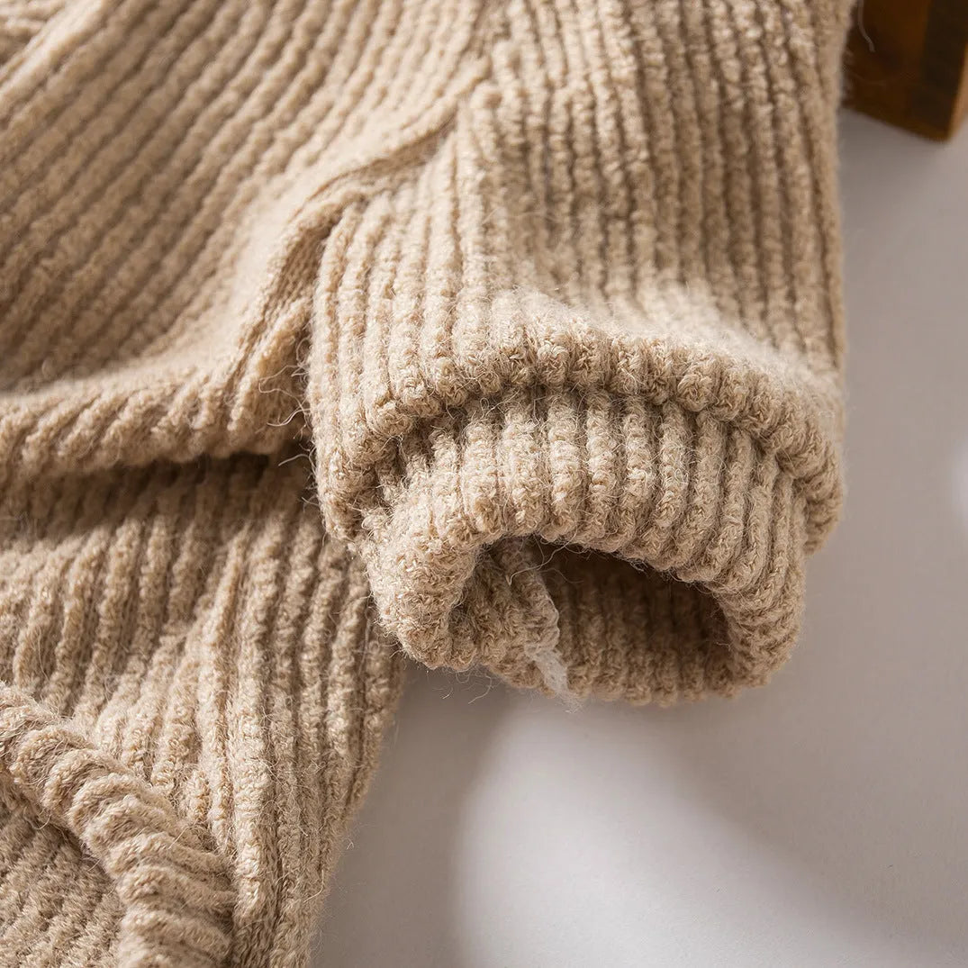 Brown cloth dog sweater pullover on a small breed dog.