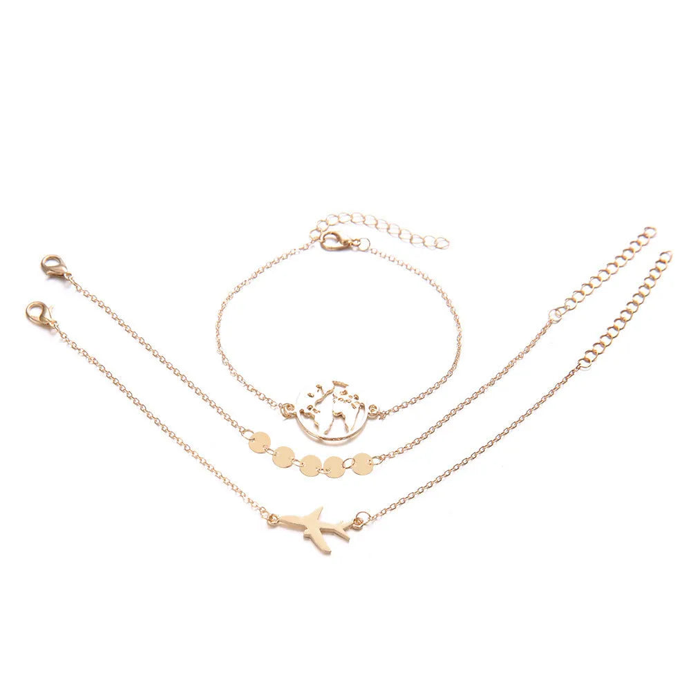 Three women's charm bracelets with heart-shaped aircraft map pendants in alloy with electroplated finish