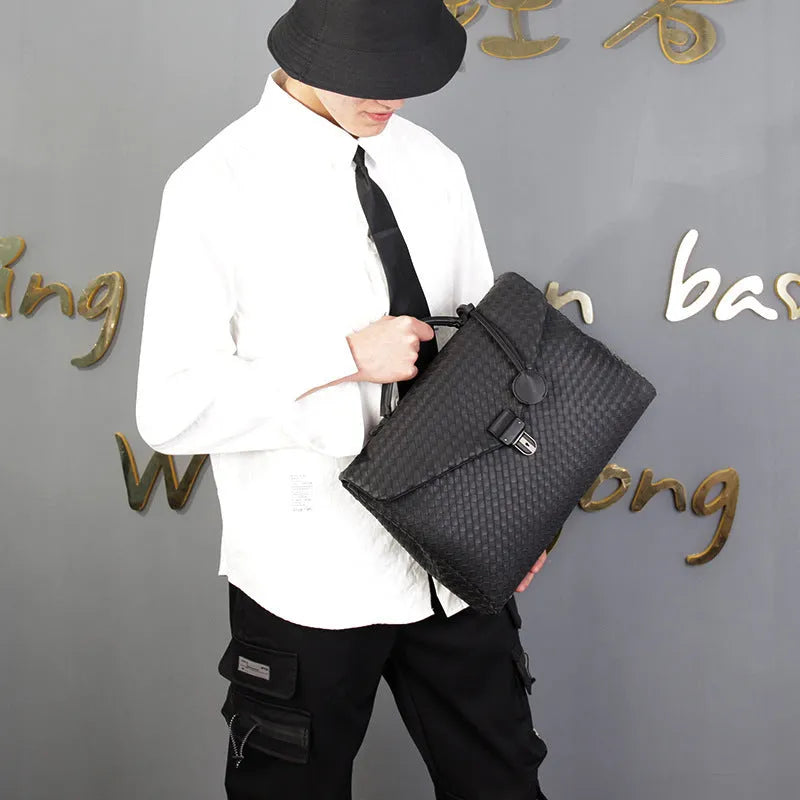 Men's handbag in black super fibre synthetic leather with clamshell knitting pattern, horizontal square shape, latch closure, and soft handle