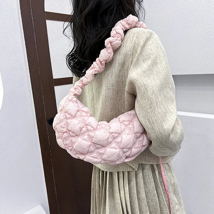 Light beige women's casual nylon shoulder messenger bag with a long adjustable strap.