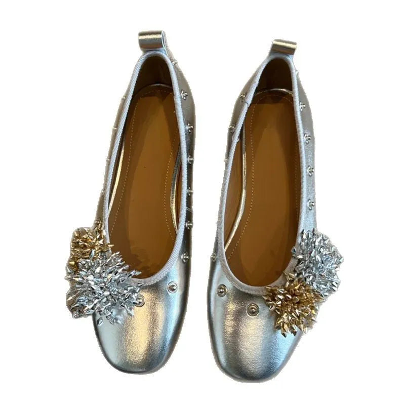 Women's silver buckle Mary Jane casual shoes with a flat rubber sole and sheepskin upper.