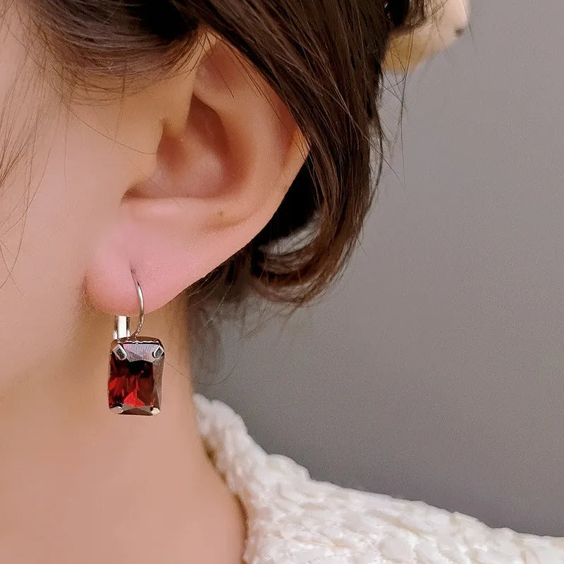 Square crystal drop earrings made from copper in purple, red, or yellow colours measuring 25mm by 10mm