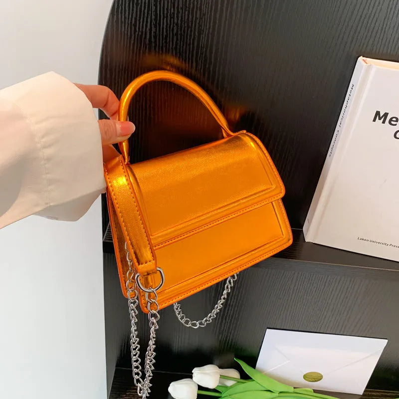 Women's retro crossbody bag in six colour options showing horizontal square shape and shoulder strap