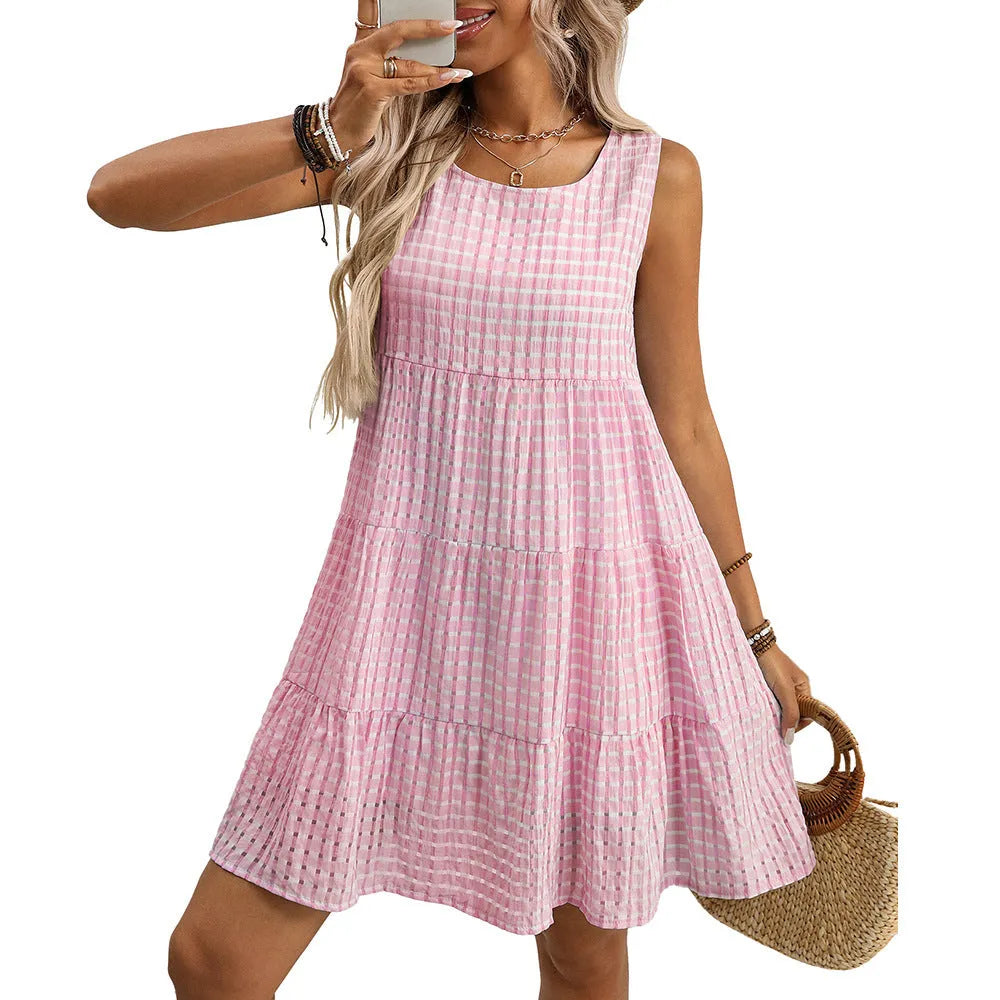 Women's sleeveless plaid dress with high waist and an oversized swing skirt in a light blue colour.