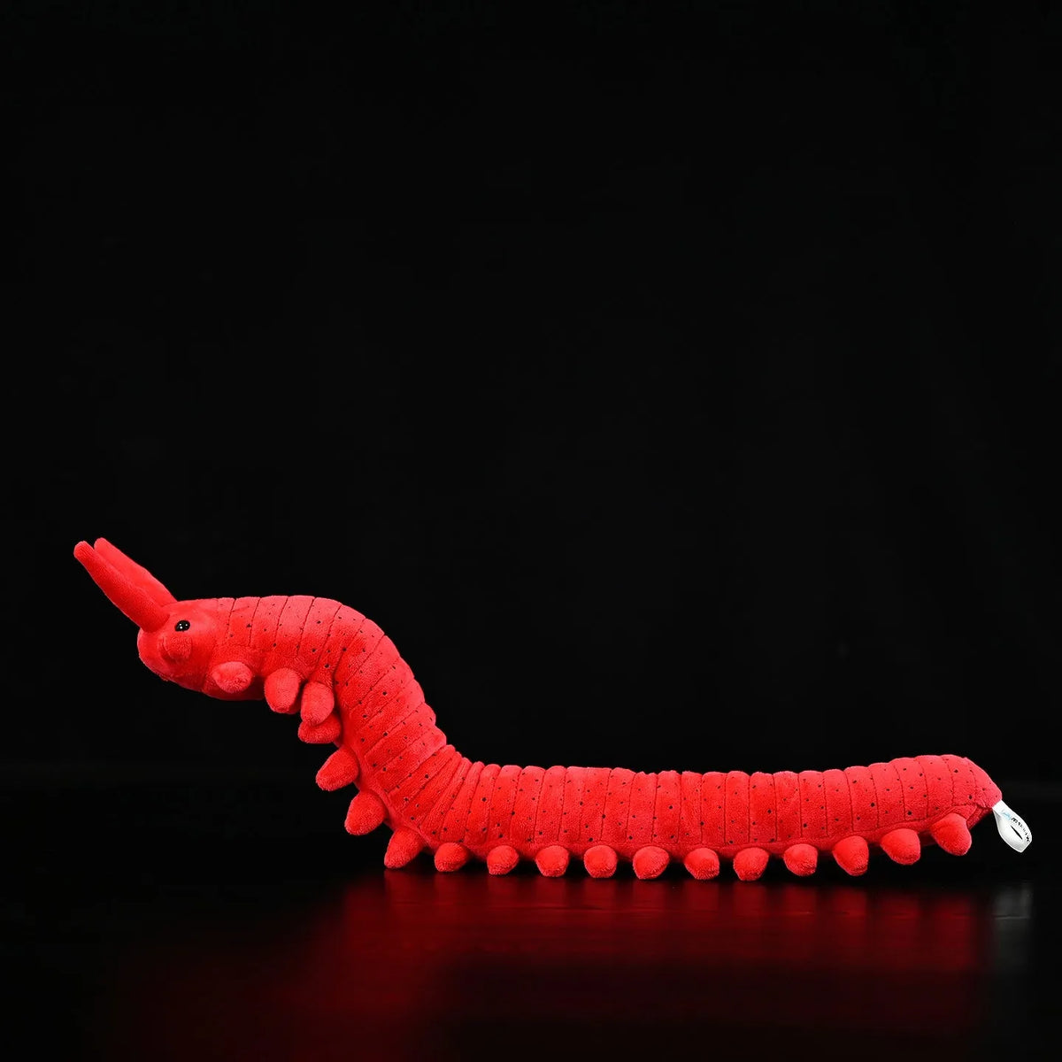 Red velvet worm plush toy silkworm doll 60cm long soft stuffed animal on a plain background