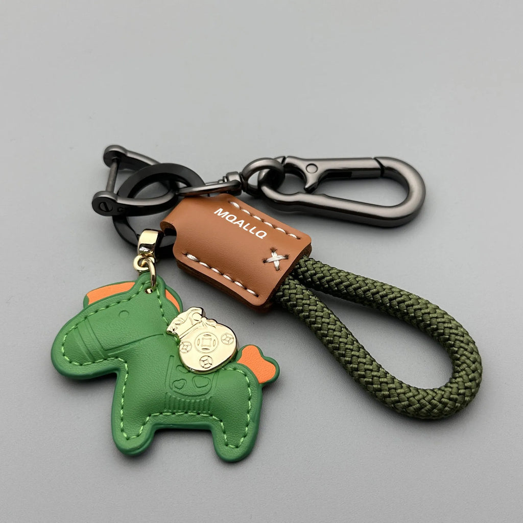 Handmade brown cowhide key ring pendant with zinc alloy pony buckle and green flanelle rope.
