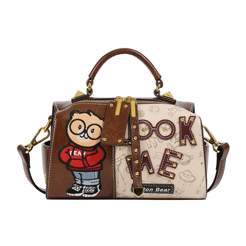 Brown PU handbag with printed cartoon design, horizontal square shape, and single shoulder strap