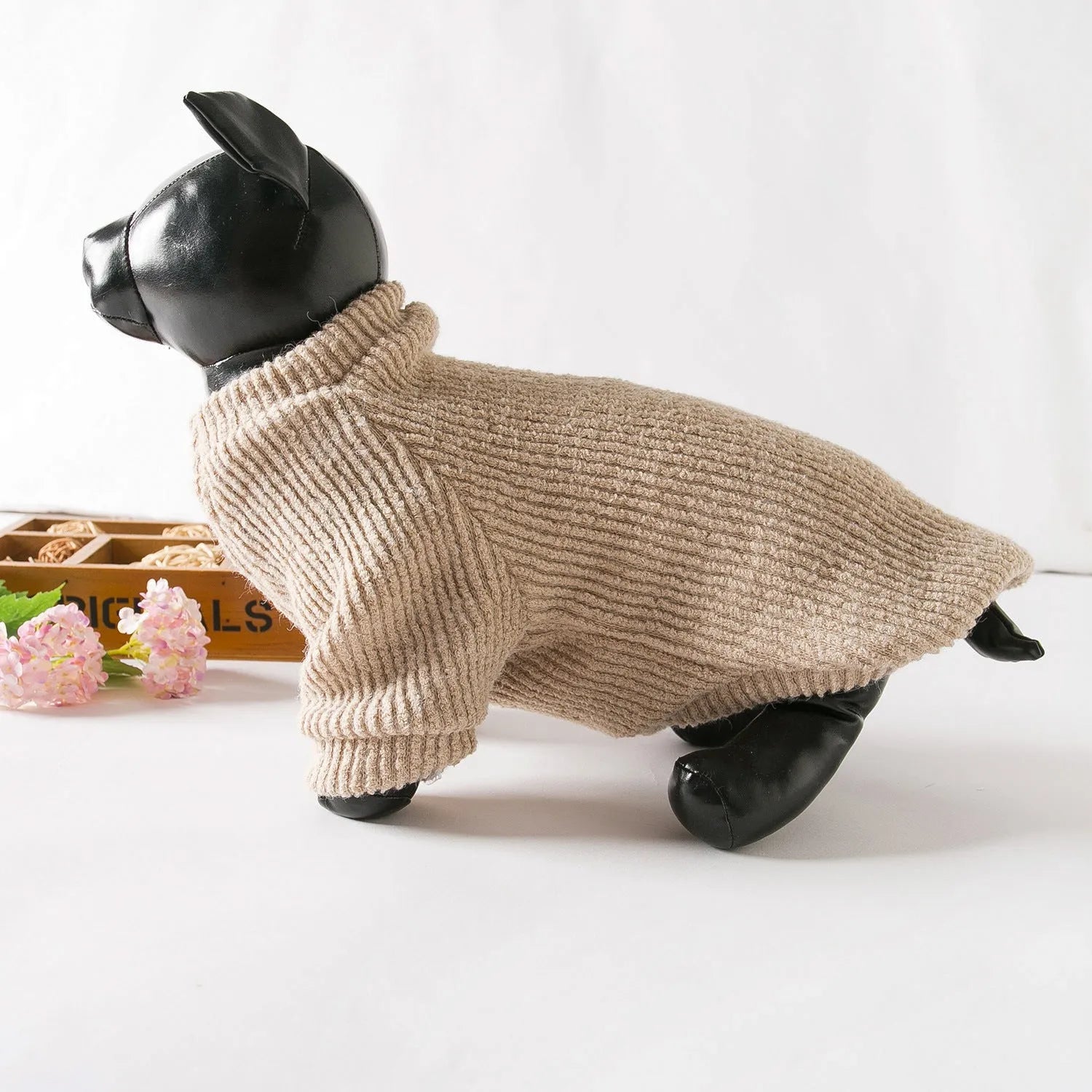 Brown cloth dog sweater pullover on a small breed dog.