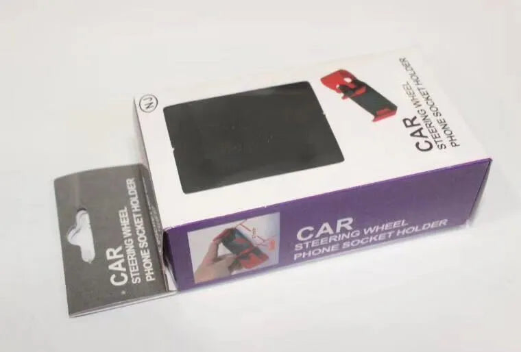 Black universal car steering wheel mobile phone holder made of ABS plastic shown mounted on a steering wheel.