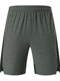 Men's forest green spandex casual shorts with a mid-waist fit on a grey background.