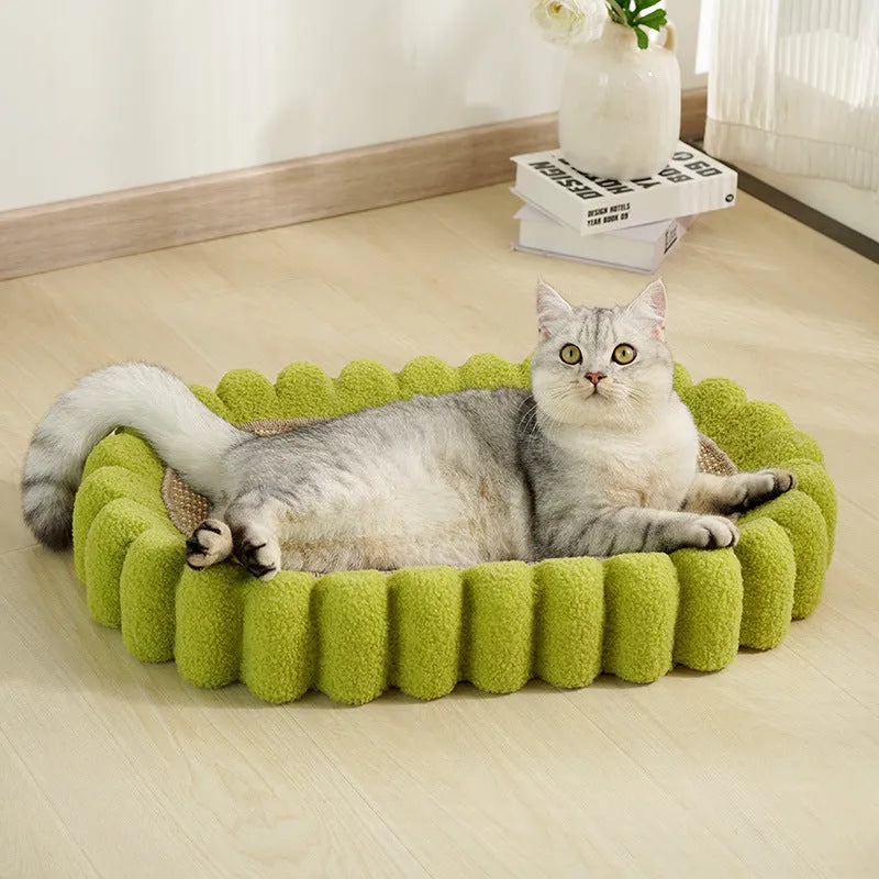 Green oval-shaped cat scratching pad serving as a bed with a sisal surface