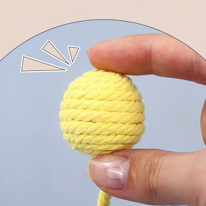 Cat toy ball with rope attached in green, pink, purple or yellow colour with internal bell