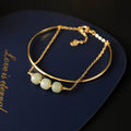 Women's Hetian jade bracelet with gold inlay design in single, double, or three-bead versions.