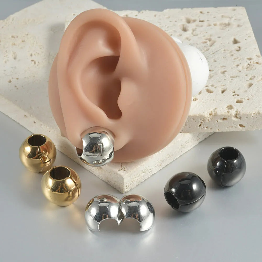 Stainless steel hollow skull and Buddha head geometric earrings in various electroplated colours.