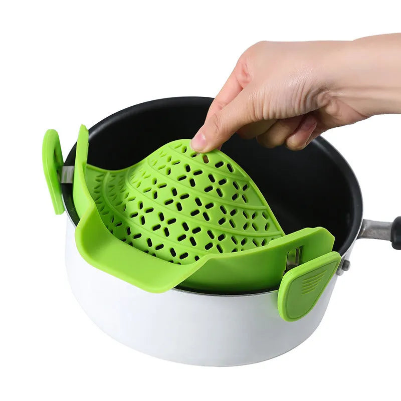 Silicone and stainless steel pot drain stopper kitchen gadget in assorted colours.