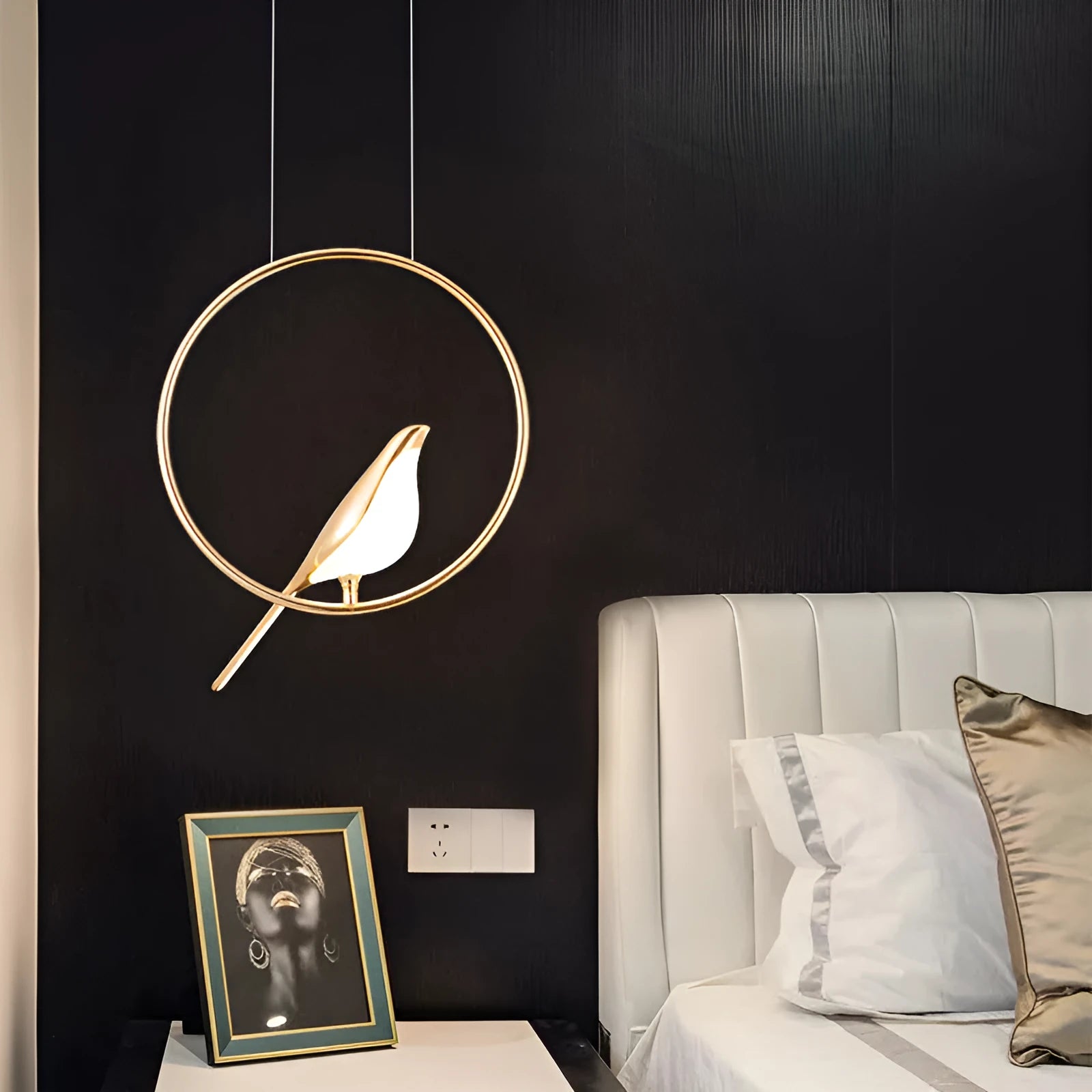 Modern linear chandelier with a minimalist metal magpie bird design and clear acrylic details, hanging 150cm long.