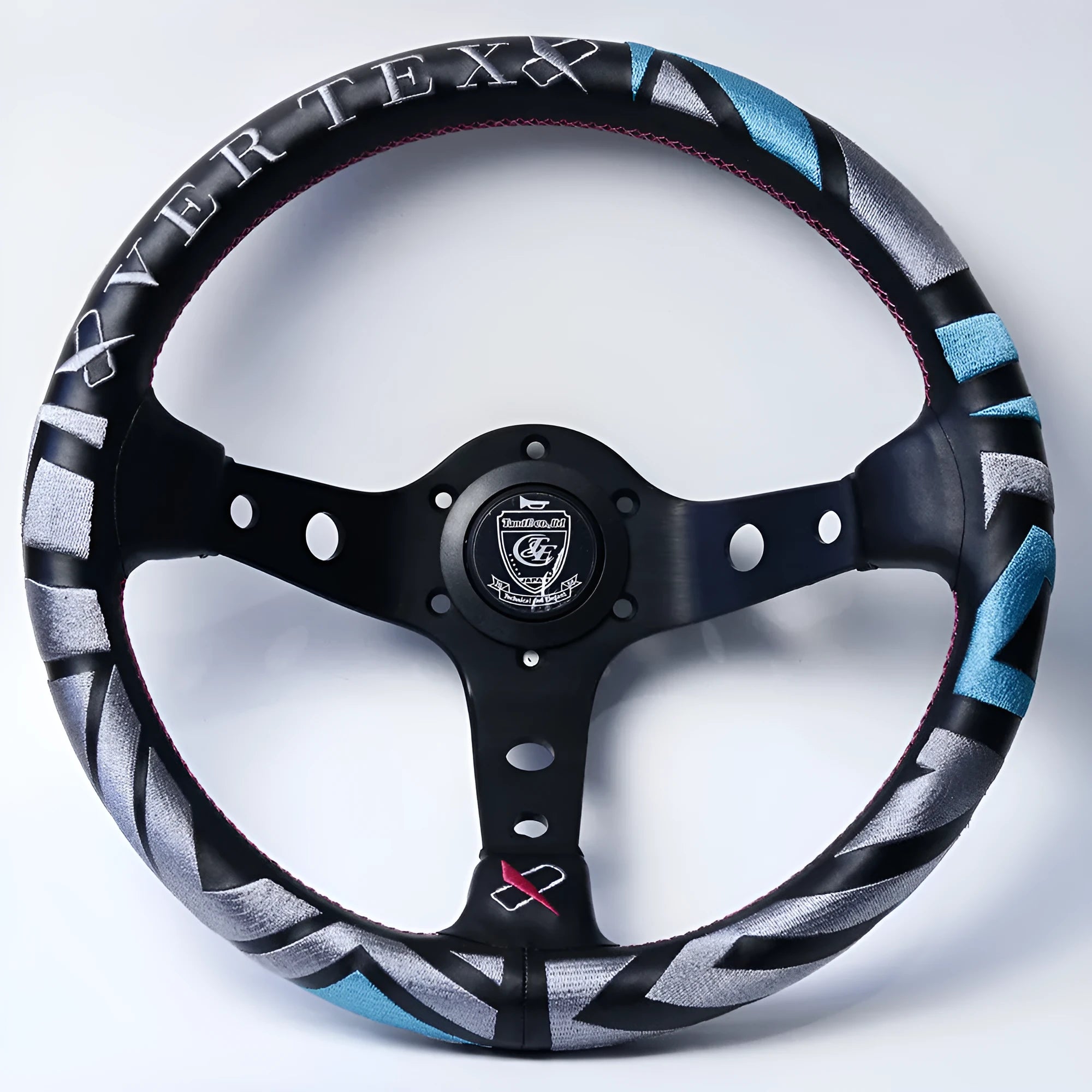 Black alloy racing steering wheel with deep concave rim and star embroidery pattern.