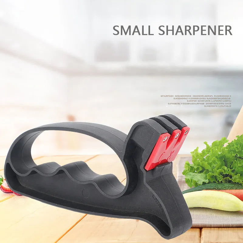 Handheld 2-in-1 black knife and scissor sharpener with tungsten steel blade on white background