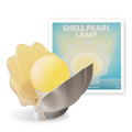 Shell pearl coloured silicone pat induction night light with power storage, disk shape 140x145x160 mm