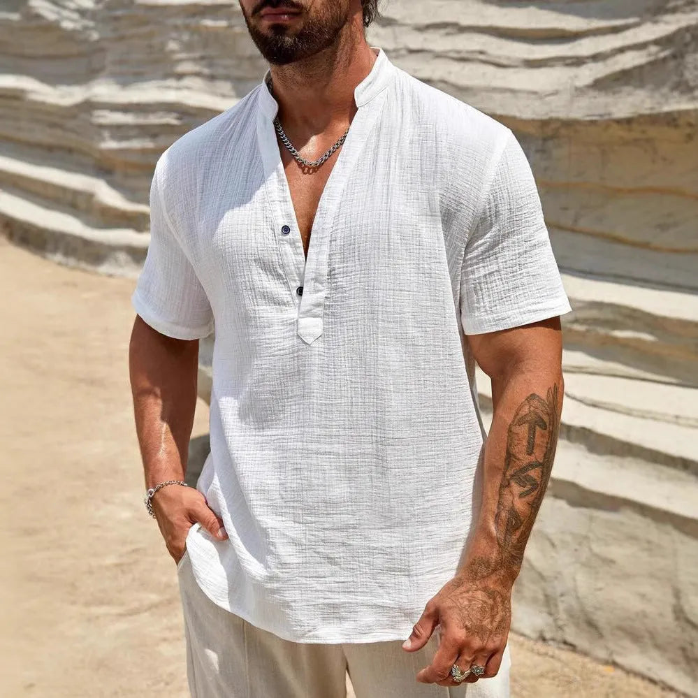 Men's solid colour short-sleeved stand collar shirt in a lightweight fabric on a hanger.